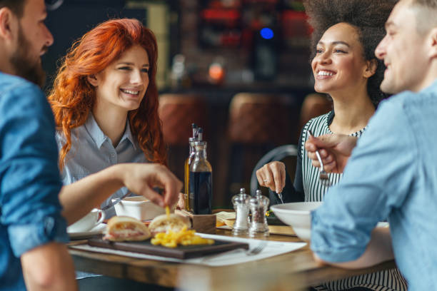 istock Friends talking and having fun at dinner party. 643139576