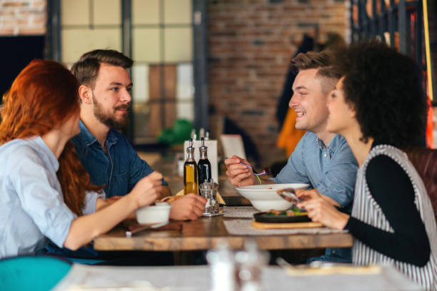 istock Friends talking and having fun at dinner party. 643140386