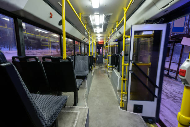 istock Interior of modern city trolley bus in back 643145504