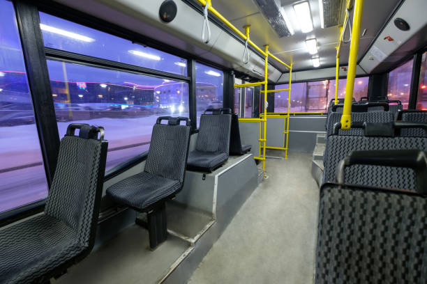 istock Interior of modern city trolley bus in back part 643145636