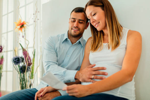 istock Pregnant woman and her man 643148382