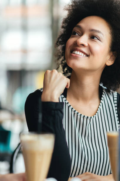 istock Smiling Young Woman Sitting at the Cafe 643148862