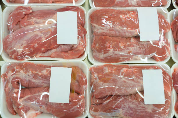 istock Slices of fresh beef on plastic packages in fridge 643153428