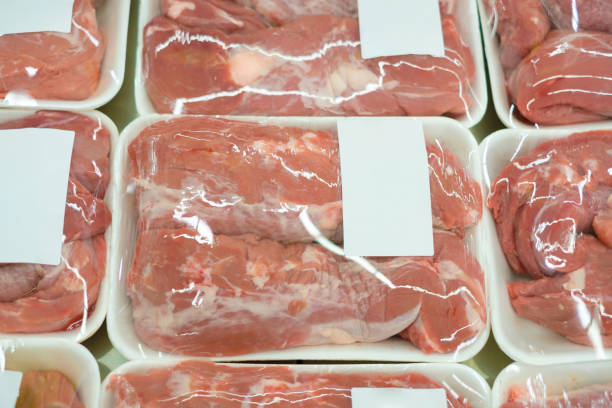 istock Slices of fresh beef on plastic packages in fridge 643153686