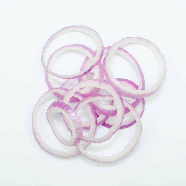 istock Sliced red onion rings isolated on white background cutout 643154210