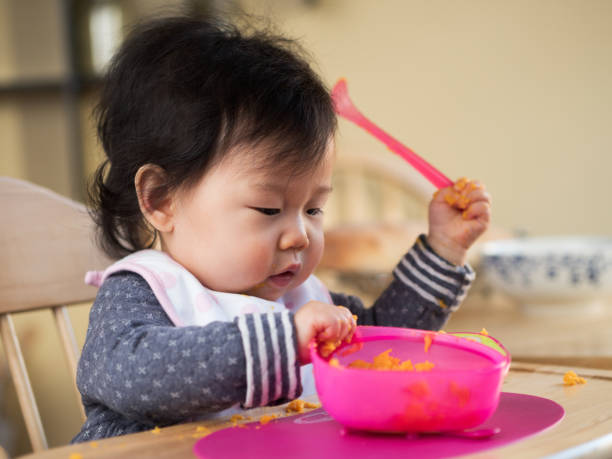 istock eating mess baby girl 643154746