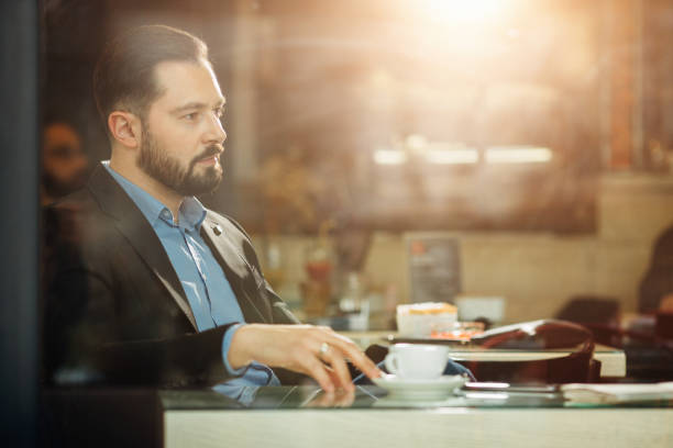 istock Young businessman sitting in cafe 643166082