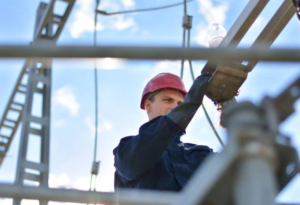 Electrician working in hight with protective equipment