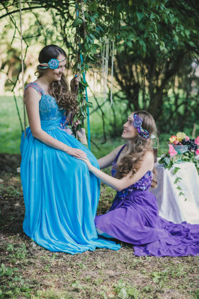 two adult sisters, twins - flower purple twin blossom imagens e fotografias de stock