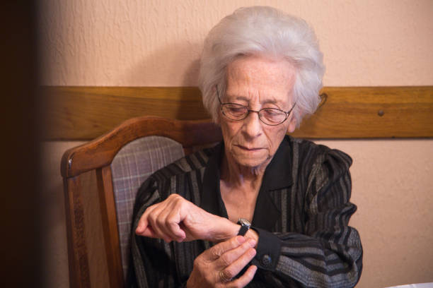 istock Senior woman looking at her smart watch 643179078