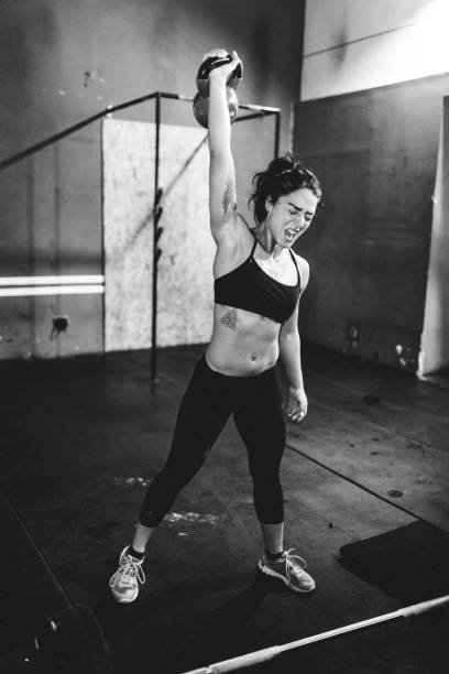istock Female Athlete doing Dumbbell exercise 643179460