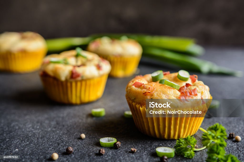 Salty bacon muffins with onion Salty muffins with bacon, green onion and cheese Savory Pie Stock Photo