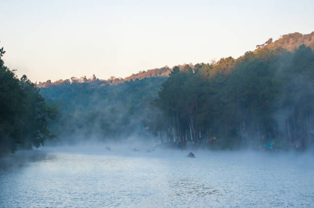 istock People on Bamboo Boat with Fog in Lake 643197310