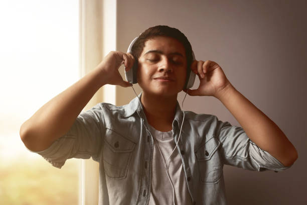 istock Man listening music 643209178