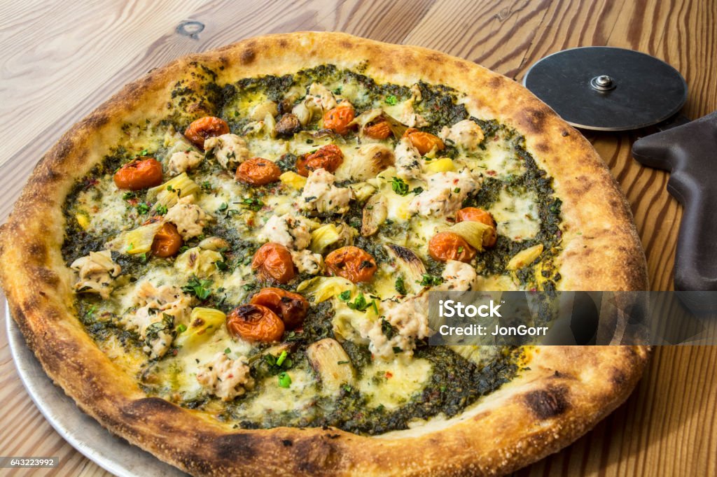 Gourmet Pizza And Cutter Artichoke Stock Photo