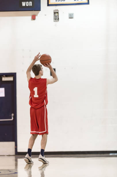istock Boys high school basketball team: 643235328