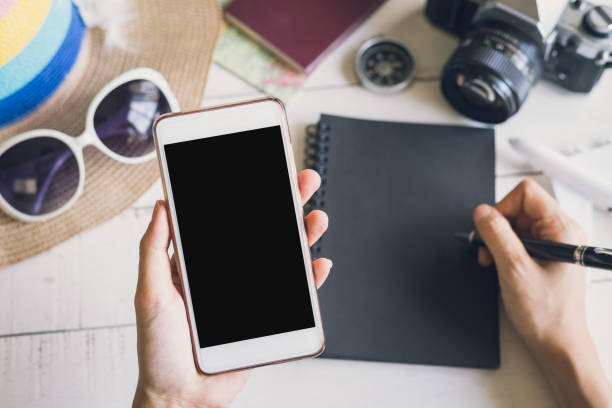 istock traveler hands with blank smartphone screen 643237624