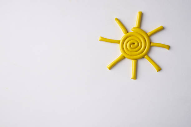 istock Yellow Plasticine sun isolated on a white background 643241480