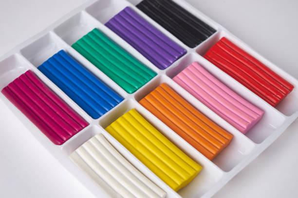 istock Colorful plasticine in box isolated on white background. 643242058