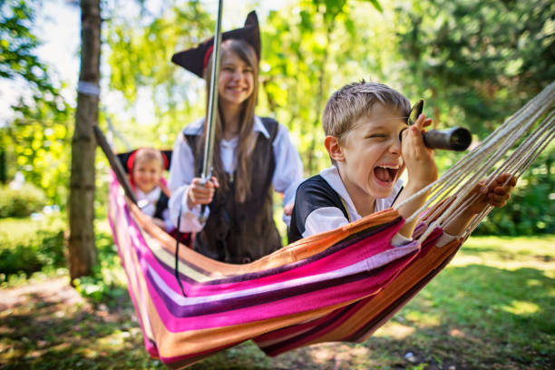 istock Kid pirates playing on a hammock boat 643245496