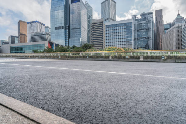 istock empty asphalt road in downtown,Hong Kong 643248280