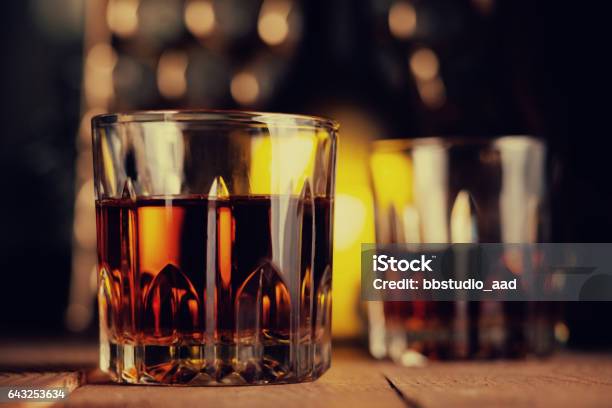 Glass Of Brandy On The Wooden Table Stock Photo - Download Image Now - Elegance, Scotch Whiskey, Alcohol - Drink