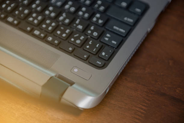 istock Close up to power button on laptop 643255644
