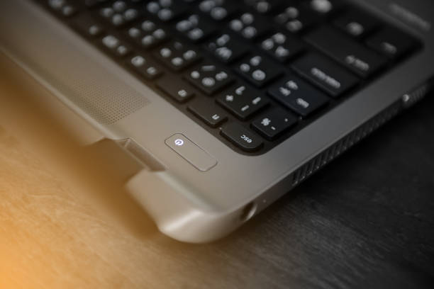 istock Close up to power button on laptop 643258276