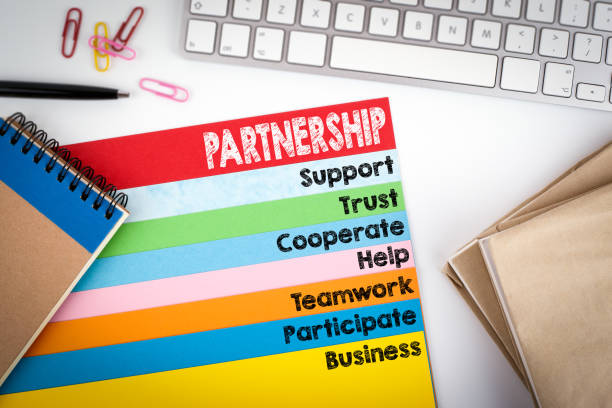 istock Partnership. Office desk with a computer keyboard and color pages 643258362
