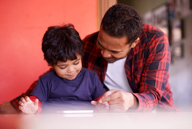istock Introducing him to a brand new world of technology 643259156