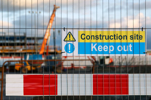 istock Construction site warning signs in yellow and blue instructing people to Keep Out. 643259388