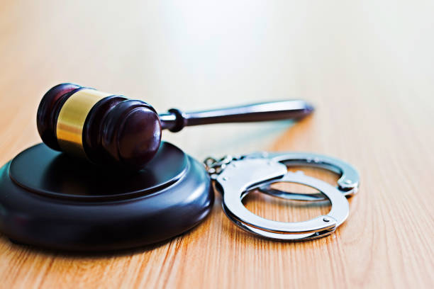 istock Gavel and handcuffs on desk 643261706