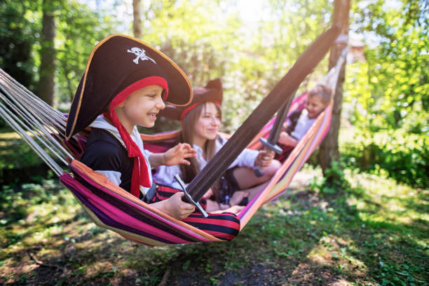 istock Kid pirates playing on a hammock boat 643261948
