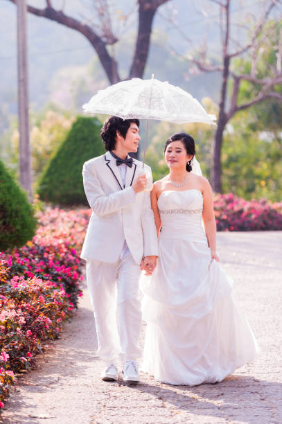 istock Asian Bride and Groom on Natural Background 643263278