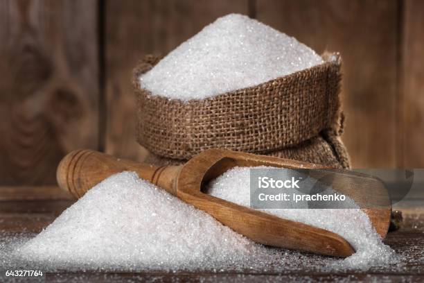 Sugar In A Bag And Spoon Stock Photo - Download Image Now - Sugar - Food, Serving Scoop, Heap