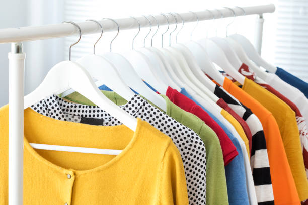 istock Collection of clothes hanging on rack 643281626