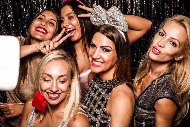 istock Taking photos with smart phone on a party 643282946