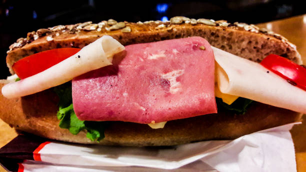 istock Ham Sandwich in whole grain bran bread with tomatoes and greens. 643290388