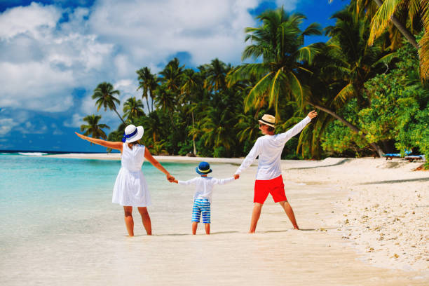 istock happy loving family with small kid on beach 643293100