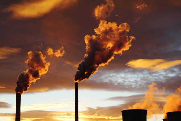 istock golden smoke from coal power plant during sunset 643293264