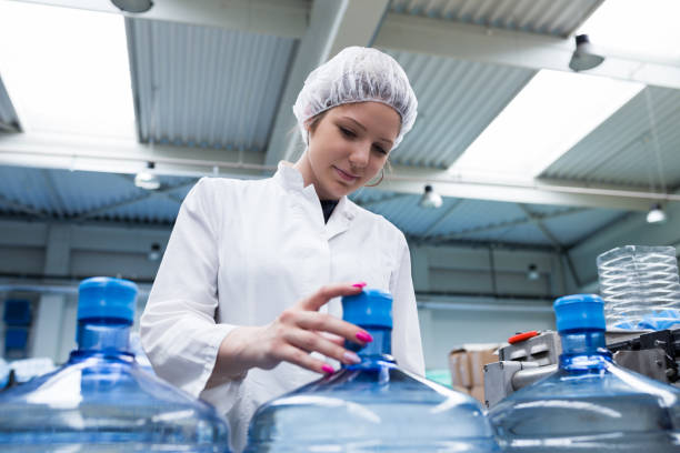 istock Water bottling factory interiors and machinery. 643300702