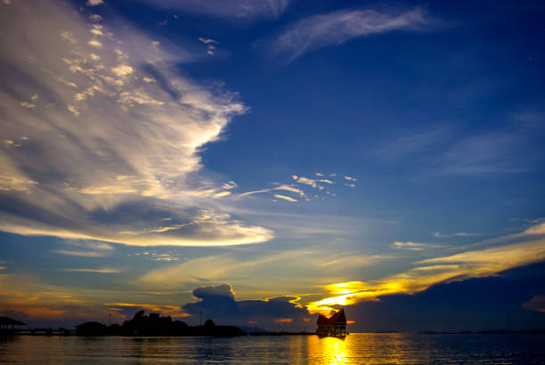 istock Nice dramatic sky at sea with island silhouette 643310616