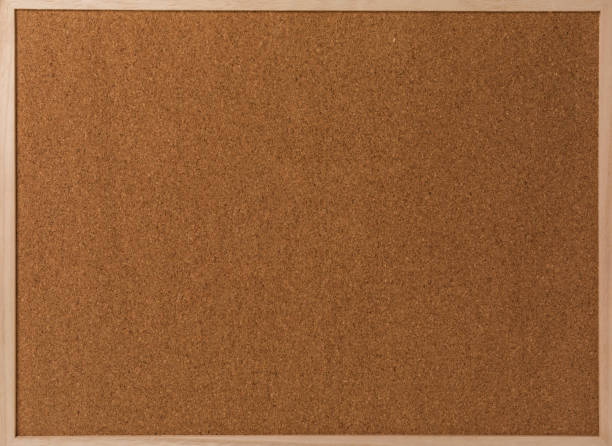 istock Fragment of a brown cork texture in wooden frame 643310764