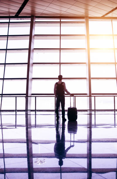 istock Businessman waiting in airport corridor 643313802