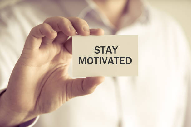 istock Businessman holding STAY MOTIVATED message card 643317048