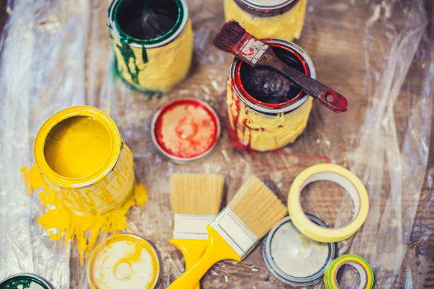 istock Paintbrush and paint cans 643317326