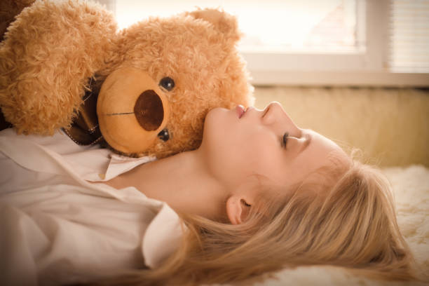 istock girl with teddy bear 643317822