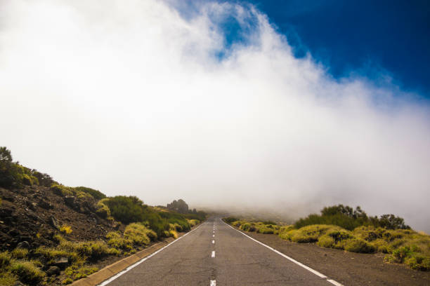 istock Road over clouds on Teide mountains in Tenerife, Canary Islands 643320254