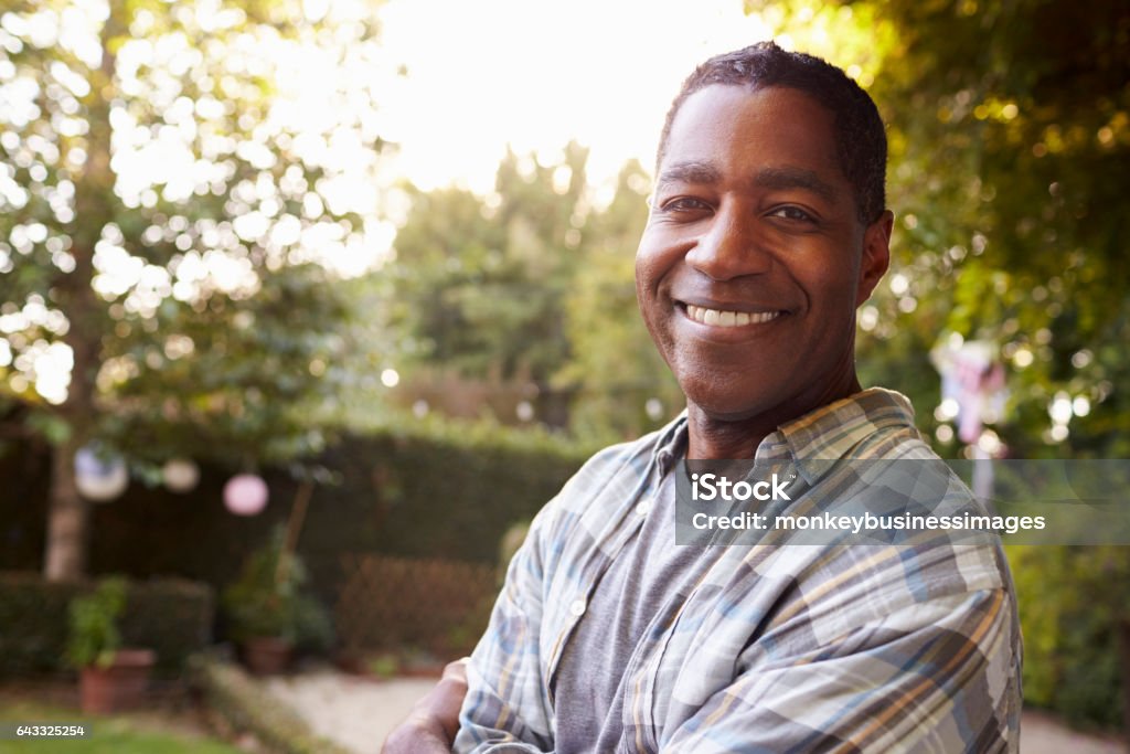 Portrait Of Mature Man In Back Yard Garden Men Stock Photo