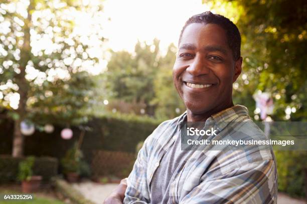 Portrait Of Mature Man In Back Yard Garden Stock Photo - Download Image Now - Men, African-American Ethnicity, Outdoors
